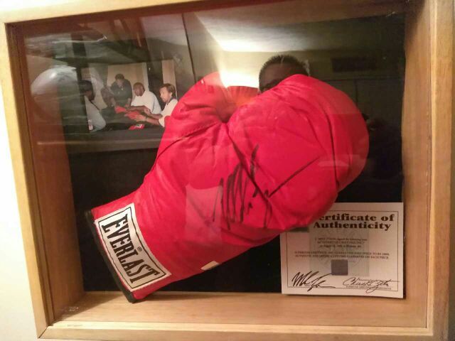 Authentic signed Mike Tyson everlast boxing glove with pics and matching holograms with certificate of authenticity