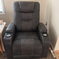 leather and mash recliner and it’s not huge and it’s not big. It’s a very nice size.