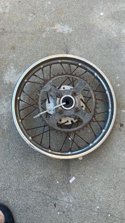 Old small motorcycle rear wheel set