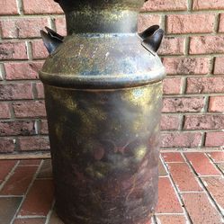 Antique Metal Milk Can with Handles. No lid. Holds about 10 Gallons. 24 inches tall with 12 inch diameter bottom and 8 inch diameter Mouth.