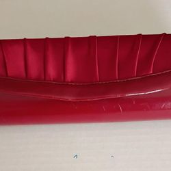 Red satin pleated evening clutch from the Spanish brand Menbur.