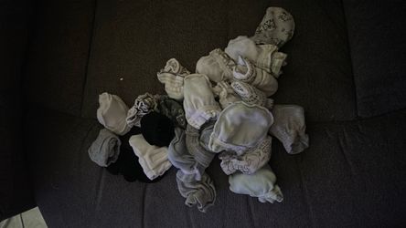 23 pairs of baby mittens