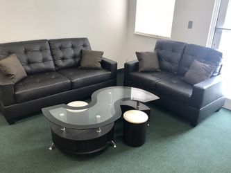 New black bonded sofa & loveseat with pillows