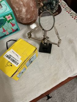 Magnifier with three handles