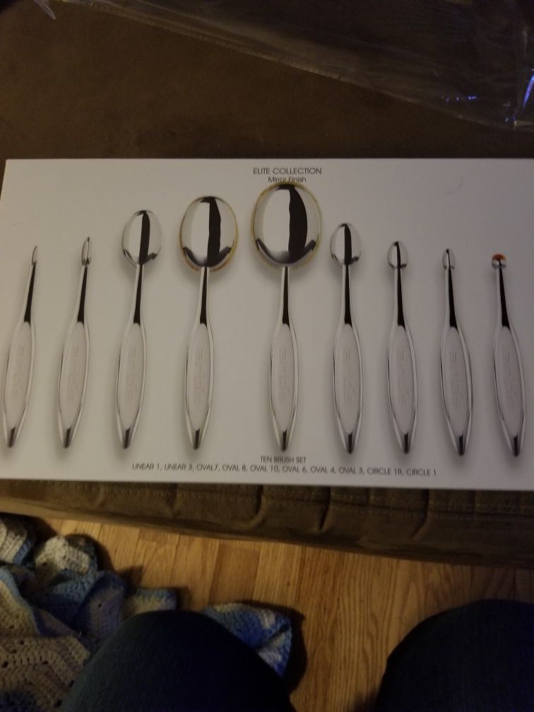 Set of professional Artis makeup brushes . Sells for $360