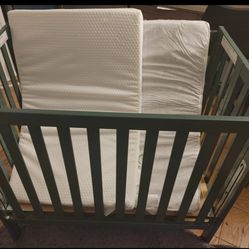 Gently Used Mini Crib With 2 Mattresses 