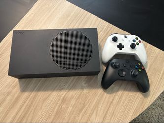 Xbox Series S and two wireless controllers