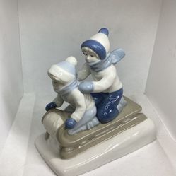 Vintage Blue & White Porcelain Figurine Two Children Sledding Made in Mexico 1992 