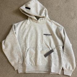 🔥 FEAR OF GOD ESSENTIALS HOODIE – LIGHT OATMEAL – SIZE L (NEW)