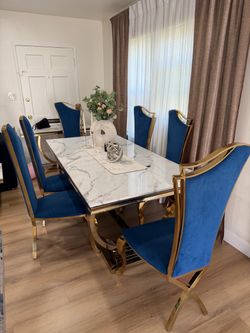 Large table with 6 chairs, coffee table and decoration table.