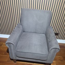 Morden  grey  upholstered accent armchair with nailhead trim
