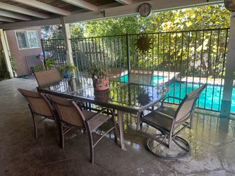 Glass patio table and 6 chairs