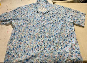 XXL Peter Millar button-up shirt featuring a whimsical "Pirate Skull Rum" all-over print on a light blue fabric