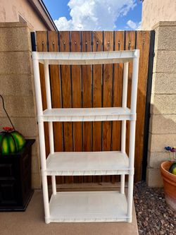 $15 - PLANO 4 Shelf plastic shelving unit.  Used indoors for crafts.   Measures 30”w x 55”t x 14.25d.  Tall.  Comes apart for easy transport.  Please 