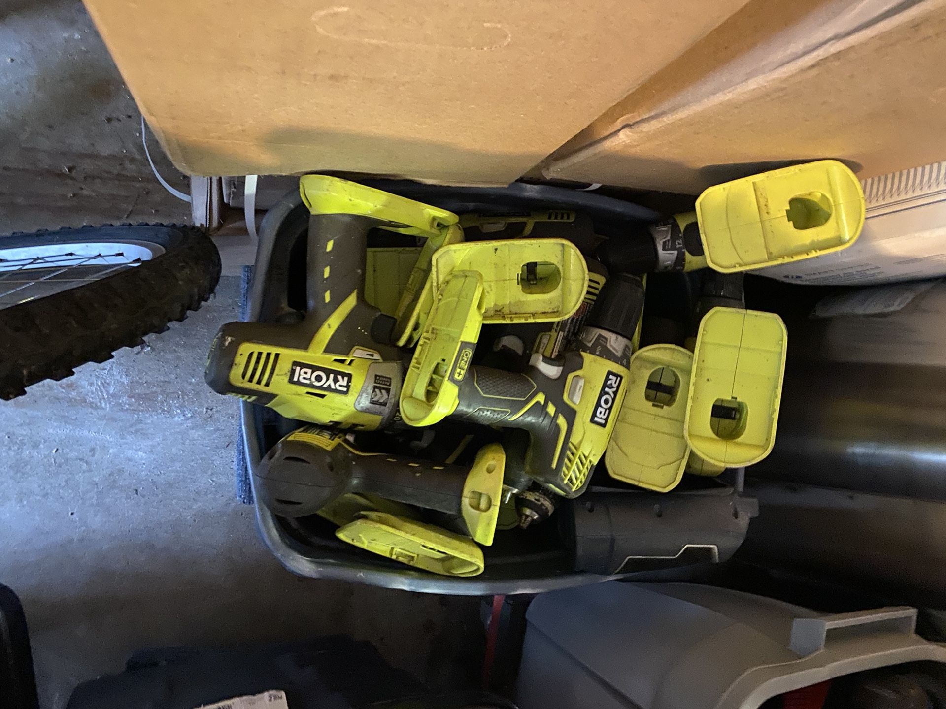 A tub of 18 V Ryobi Drills all Work