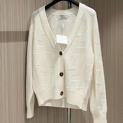 Hermes cardigan in ivory. Size M, but fits small.