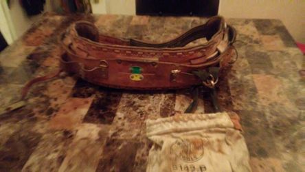 Wait belt for a roofer or cable worker to strap on anything you desire to take with you up to a roof or pole with this belt.