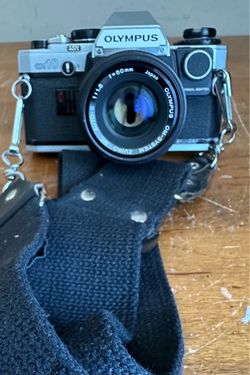 Olympus OM-10 35mm SLR Film Manual Focus Camera w/ 50mm Lens Filter Kit