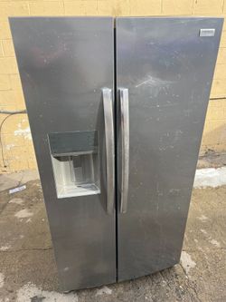 Frigidaire stainless steel side by side refrigerator  -free delivery