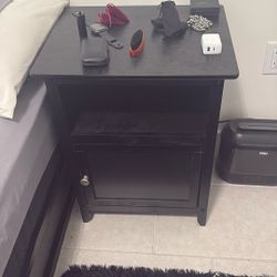 black wooden bedside table 