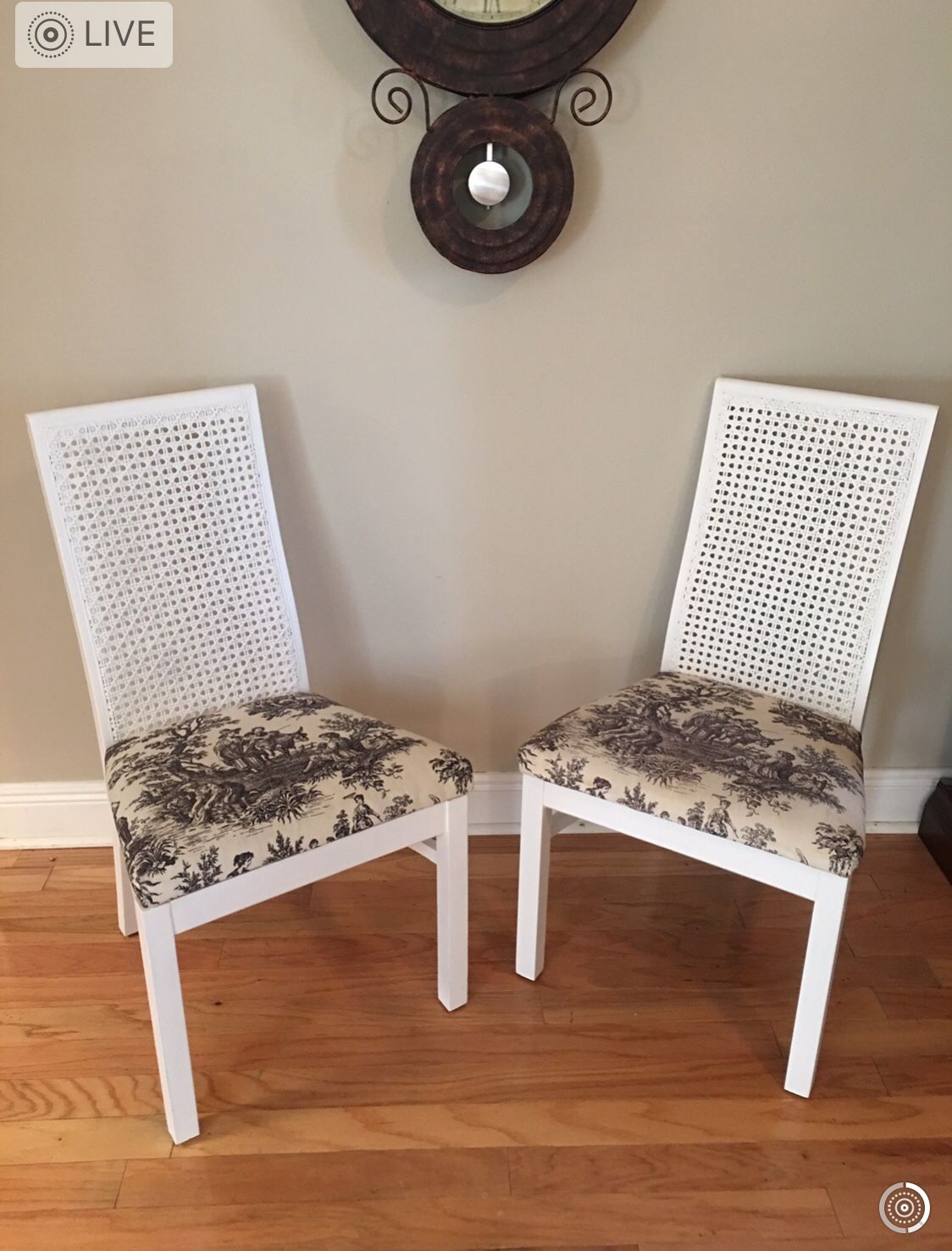 Two cane back wooden chairs. Sturdy, real wood. 38" high. Freshly painted. French motif cream & Black fabric seats. Condition: Like new