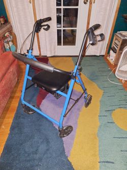 Wheeled walker with seat