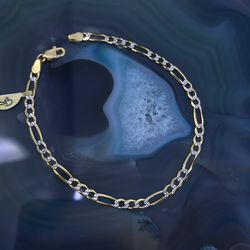 $600 Two Tone Yellow and White Gold Figaro Bracelet