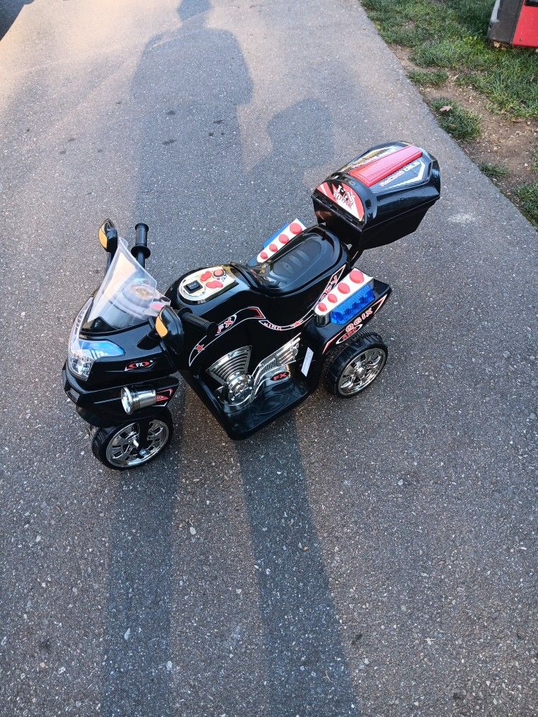 Kids battery operated motorcycle with charger works great used a couple of times