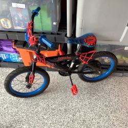 Huffy Spiderman themed 16” BMX bicycle in excellent condition. With blue wheels, spiderweb handlebar,foot breaking system.  I do have a set of trainin