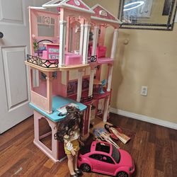 DREAM HOUSE BARBIE IN VERY GOOD CONDITION NICE AND CLEAN COMES WITH TOYS,CAR AND EVERYTHING YOU SEEN IN THE PICTURE FOR ANY QUESTION TEXT ME PLEASE