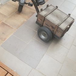 Custom-built tricycle with a wooden cargo box attached to the rear