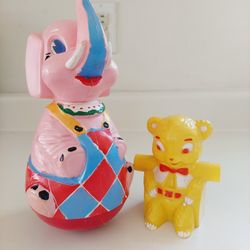 Vintage Toys 9" Pink and Red Roly Poly Elephant that makes a rattle sound when played with and small yellow teddy bear. The elephant has a large open 