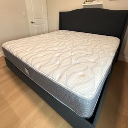 King-size bed frame with mattress and box springs