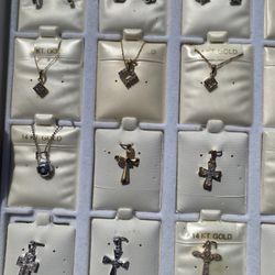 New 14 karat gold and diamond crosses