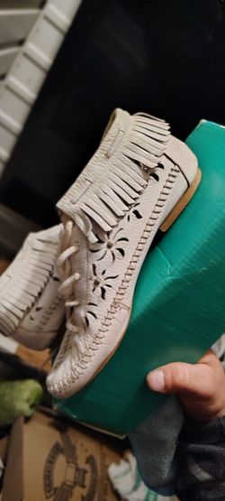 White Leather Fringed Ankle Moccasin Boots With A Hand Stitch Vamp And Floral Cut Out Details