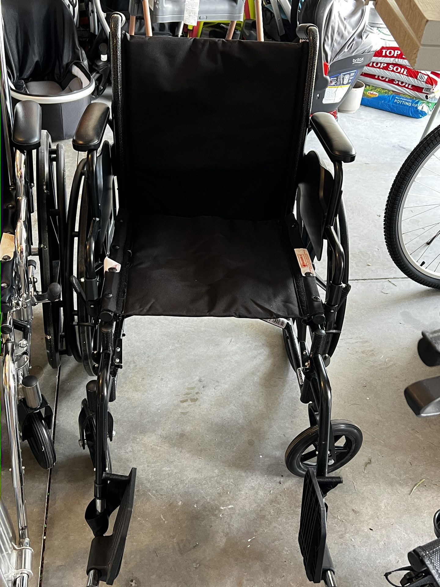 Collapsible Wheelchair With Footrests 