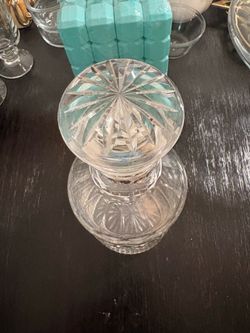 It is a vintage cut-glass decanter featuring this classic pattern and a triple-ring neck.