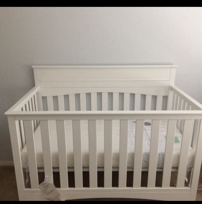 Delta crib convertible to bed with mattress