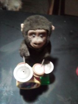 Old school playing monkey drum set