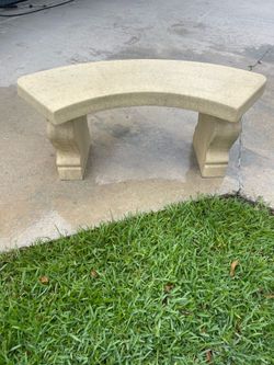 Curved concrete garden bench