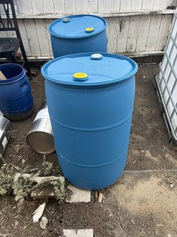 55 gallon Plastic Drums clothes top $20 each