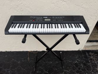 Used Piano and stand