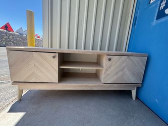 Tv Stand holds up to a 65”