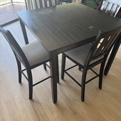 Tall wood chairs with table