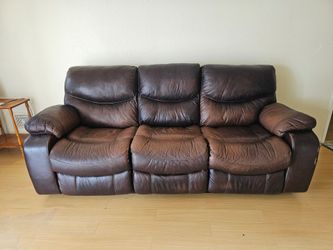 Dark brown leather three-seater sofa