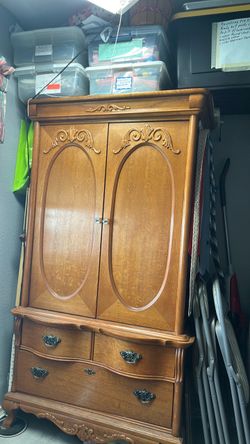 Wood Armoire with Drawers and Carved Detail