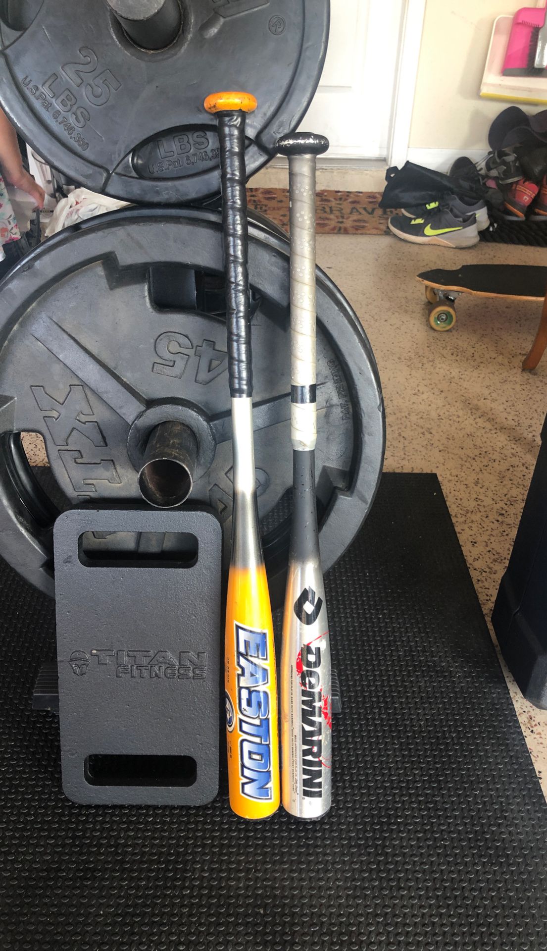 Youth baseball bats, one dimarini, one Easton