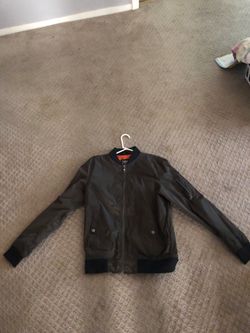 Olive green windbreaker worn 1 time