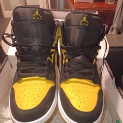 Black and yellow Jordan 1 retros