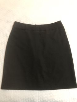 B. Moss size 6 stretchy black mini skirt with a vent in the back and zips up the back WAIST:29” LENGTH:19.5”
